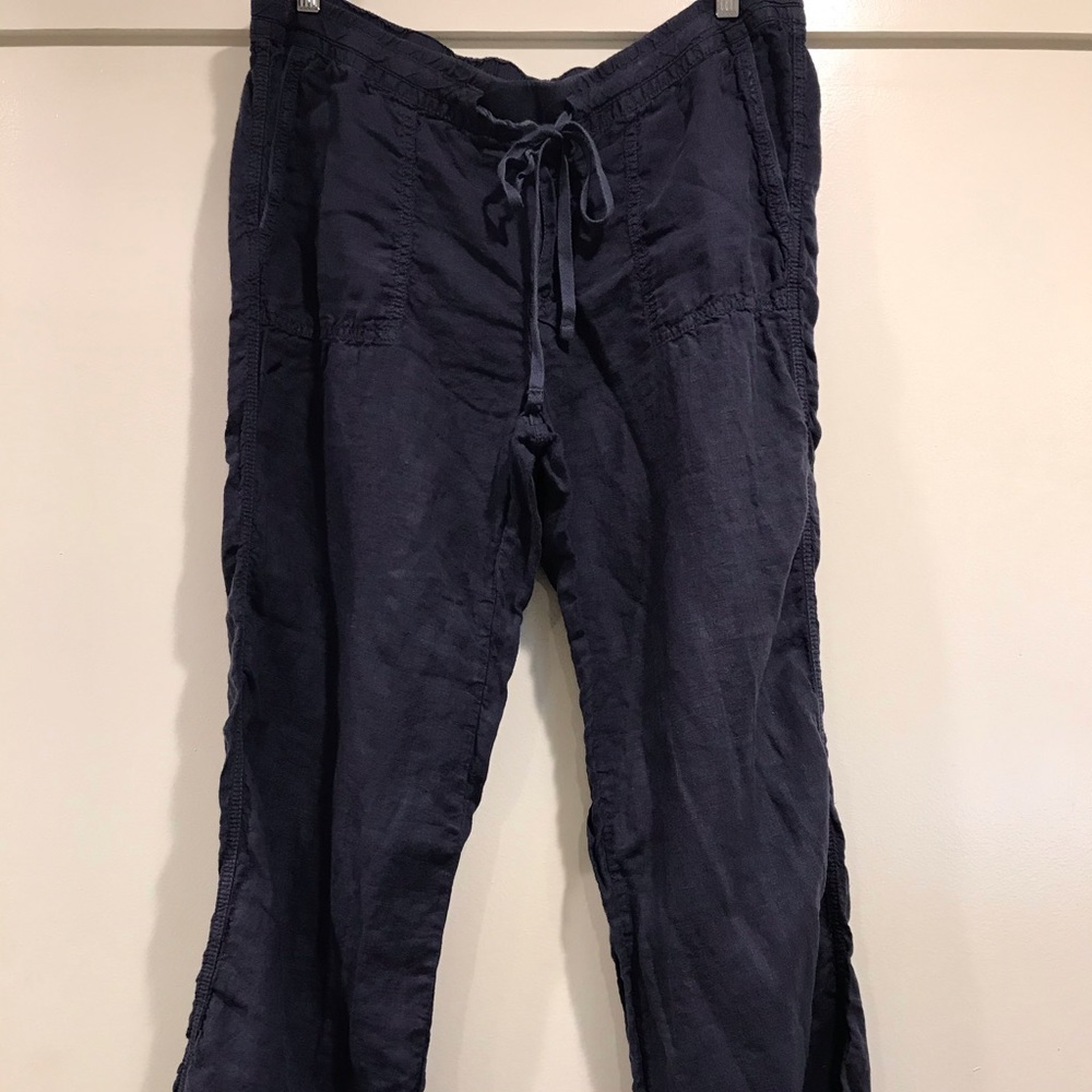 Navy linen pants with drawstring waist.